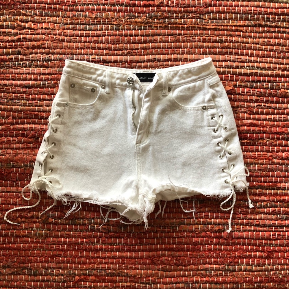 White denim shorts with shoes lace ties